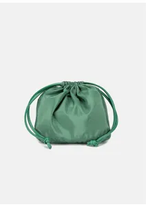 Green drawstring pouch detail, soft material and double cord design, elegant accessory close-up.