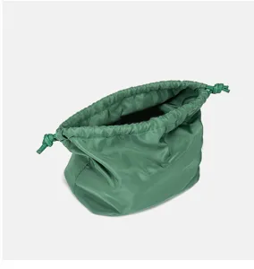 Green nylon drawstring pouch waterproof cosmetic travel storage bag lightweight fashion handbag.