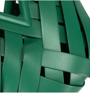 Close up detail of green woven leather handbag, premium textured designer style shoulder bag.
