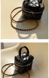 Detail view of black quilted mini handbag with gold chain strap, luxury style aesthetic.