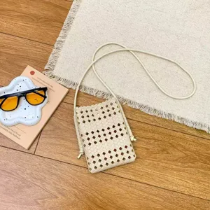 Woven soft leather crossbody phone bag, casual minimalist cutout design for summer use.