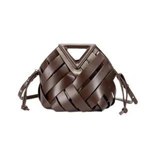 Dark brown woven leather top handle handbag with stylish triangle frame and crossbody strap.
