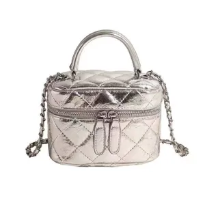 Silver quilted mini vanity bag with top handle and chain strap for women fashion style.