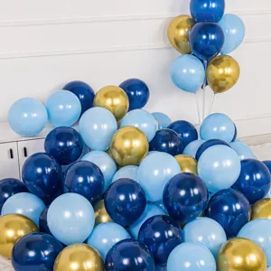Detailed view of the balloon set showing matte dark blue, light blue, and metallic gold balloons.