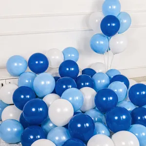 Matte blue and white balloon details, close-up of colorful latex balloons for party decor.
