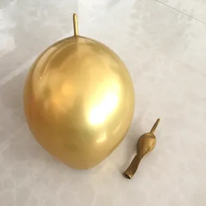 Detail shot of metallic tail balloons, showing inflated and deflated golden party balloons.