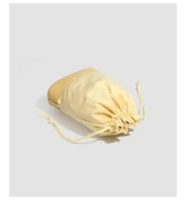 Detailed view of the yellow velvet drawstring jewelry storage bag, ideal for accessories.