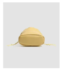 Yellow drawstring jewelry storage pouch detail views featuring soft velvet textures.