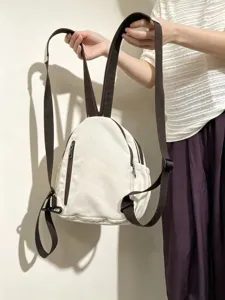 Petit sac à dos en toile blanche style coréen avec bretelles marron pour les femmes.