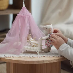 Miniature dollhouse furniture set with pink canopy bed and cute mouse doll toys for kids play.