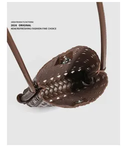 Summer woven soft leather crossbody mobile phone bag detail showcasing hollow cutout design.