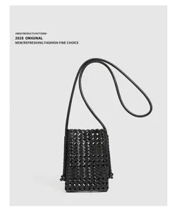 Black woven leather phone bag detail, mini crossbody pouch, soft leather intrecciato style.