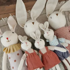 Detail view of Nordic cotton linen lop-eared rabbit plush dolls set with cute handmade outfits.