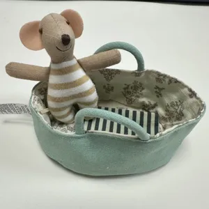 Miniature plush mouse doll in basket, cute dollhouse toy accessory, detailed kids gift.
