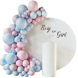 Gender reveal balloon arch kit with pink and blue balloons and round backdrop stand.