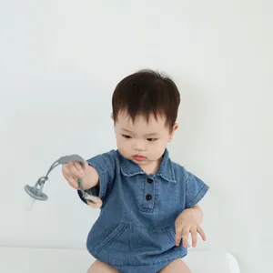 Silicone pacifier clip detail view, soft grey teething strap and secure fastener for baby.