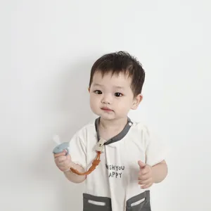 Close-up detail shot of baby pacifier clip and silicone strap accessory for infants and babies