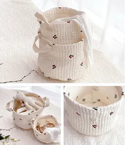 Quilted cotton storage basket with cute cherry embroidery, perfect for home organization.