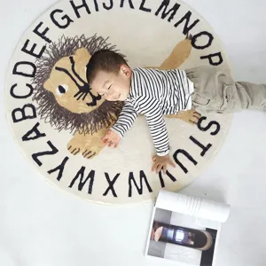 Detailed view of soft round children rug with cute lion and alphabet print, cozy lifestyle.