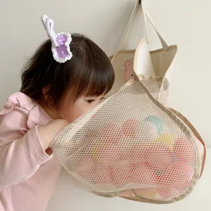 Baby bath toy mesh storage bag with cute rabbit design, hanging organizer for bathroom use.