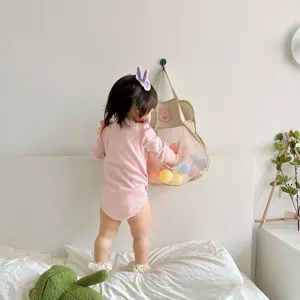 Hanging mesh toy storage bag with cute rabbit design, perfect for bathroom organization.
