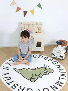 Round kids rug with alphabet and dinosaur cartoon print, soft nursery bedside floor mat.
