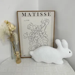 Cute white fluffy rabbit plush toy with long ears, soft stuffed animal for kids and baby room decor.