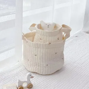 Detailed shot of Korean style quilted cotton storage basket with cute bear embroidery.