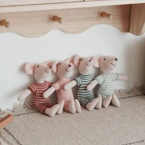Charming textile mouse doll with striped knit clothing, ideal for kids room decor and play.