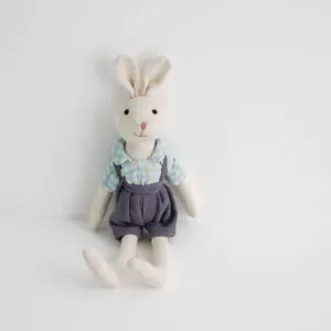 Linen rabbit plush toy with cute checkered shirt and overalls, vintage style hugging doll.