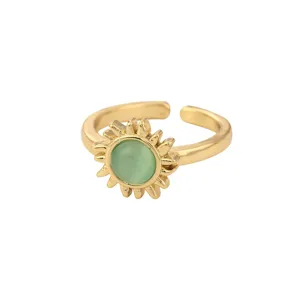 Detailed close-up view of the golden open ring featuring a green stone sunflower design.