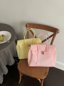 Detail shot of the stylish PVC jelly tote bag in pastel colors, showcasing large capacity.