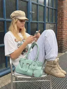 Y2K street style green motorcycle handbag with metal buckles and large capacity for women.