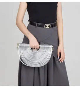 Silver metallic half moon handbag unique pleated noodle shoulder bag for stylish women.
