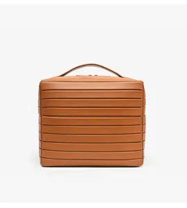 Detail shot of the brown striped cosmetic storage bag, showing structured texture and handle.