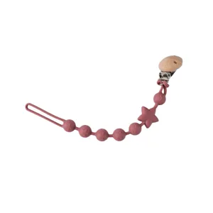 Lebensmittelechter Silikon Schnullerclip Beisskette mit bunten Sternen und naturlichem Holzclip.