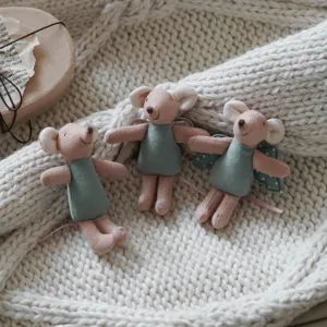 Detail view of 10cm mini mouse plush doll with wings and green dress for dollhouse play.