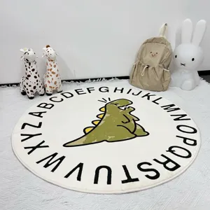 Detailed view of the round nursery rug featuring alphabet letters and a cute dinosaur print.
