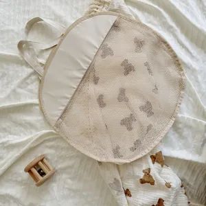 Cute bear pattern circular mesh bath storage bag with handles for baby toy organization.