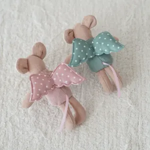 Mini plush mouse doll with angel wings and polka dot pattern, cute dollhouse toy for children.
