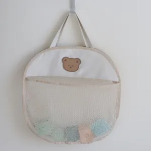 Hanging mesh bath toy storage bag, cute bear design, breathable nursery organizer for kids.