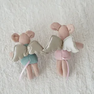 Close-up detail of cute 10cm plush mouse toys with golden angel wings and pink ribbon tails.
