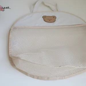 Detailed view of the cute bear mesh bathroom hanging storage bag for baby bath and toys.