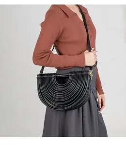 Black half-moon crossbody bag for women, stylish niche design pleated handbag with shoulder strap.
