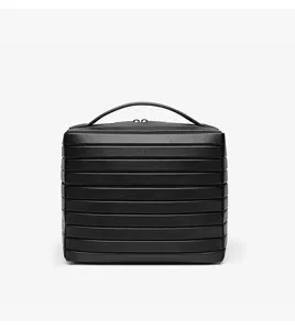 Detail view of black striped cosmetic case, textured hardshell travel storage bag with handle.