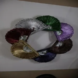 Detailed view of handmade woven semi-circular crescent handbag in multi-color options.