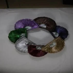 Detailed display of colorful handmade woven crescent handbags featuring a very stylish design.