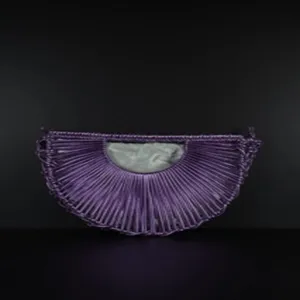 Detailed view of the purple handmade woven half-moon hobo bag featuring an inner pocket.