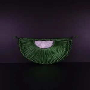 Close-up detail of the dark green hand-woven semi-circular crescent handbag inner pocket design.
