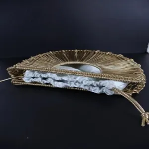 Woven crescent handbag with inner drawstring pouch, stylish half-round fashion design.